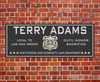 Image of a personalized police badge sign in black with stars, ideal for law enforcement decor.