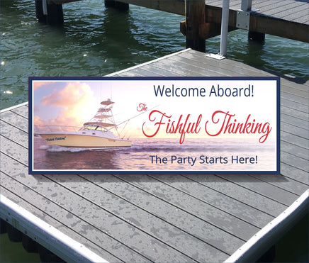 Personalized Welcome Sign featuring a serene seascape with a large yacht and fishing poles. The background showcases a golden and blue sky with fluffy clouds and calm waves. Customizable blue text includes the owner's name and welcoming phrases like 'Welcome Aboard!' and 'The Party Starts Here!' Ideal for beach houses or docks.