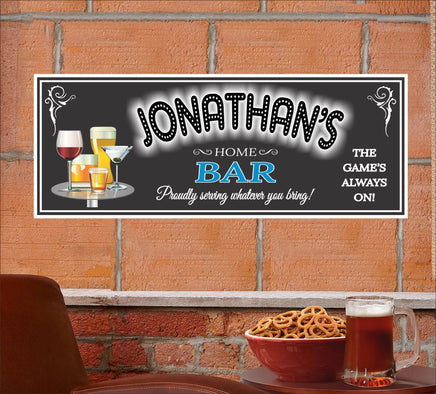 Custom bar sign featuring the text 'The Game's Always On' with a background in customizable team colors, displaying various mixed drink illustrations and personalized text options. Note: This sign does not light up.