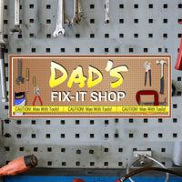 Personalized 'Dad’s Fix It Shop' sign with an editable text feature, showcasing tools on a pegboard background and yellow caution tape accents.
