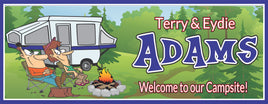 Personalized RV sign featuring a cartoon couple relaxing by a campfire with their RV in the background. All lines of text are editable, including the family name and "Welcome to our Campsite."