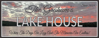 Personalized Lake House Sign depicting a stormy sunset sky over tranquil waters. Custom wall art designed for lakefront homes, adding rustic charm or modern elegance. Handcrafted with meticulous attention to detail, featuring customizable options for a unique touch. Bring the beauty of the stormy sunset sky into your home with this stunning piece of decor.