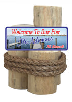 Pier Welcome Sign with Lake and Boat Dock
