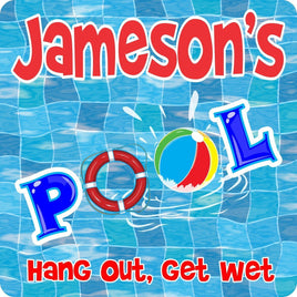 "Personalized Swimming Pool Sign with wavy blue mosaic background, beach ball, and life preserver. Raft & Inflatable Beach Ball