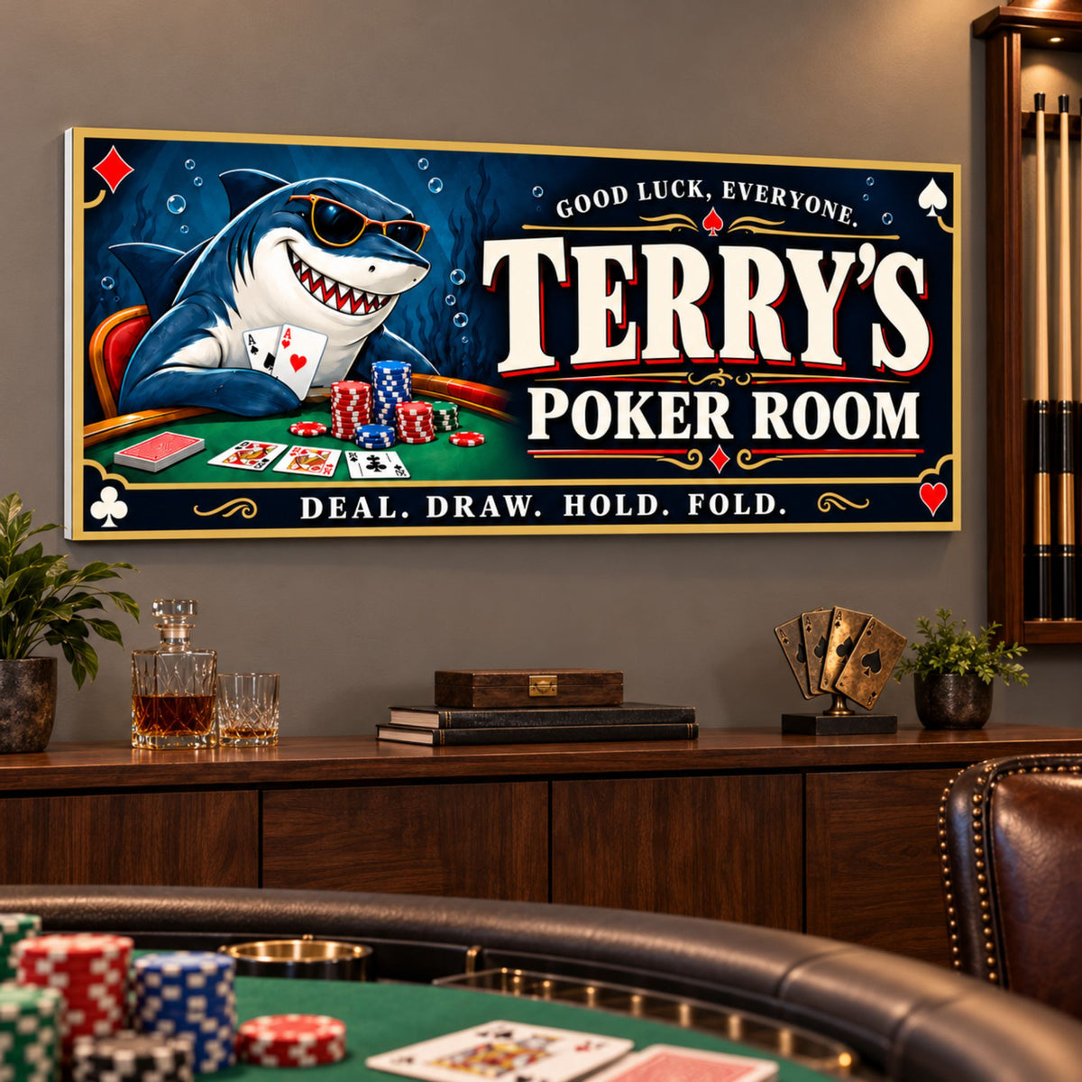 Personalized shark poker room sign mounted above a walnut console, with pool cues and a green poker table nearby.