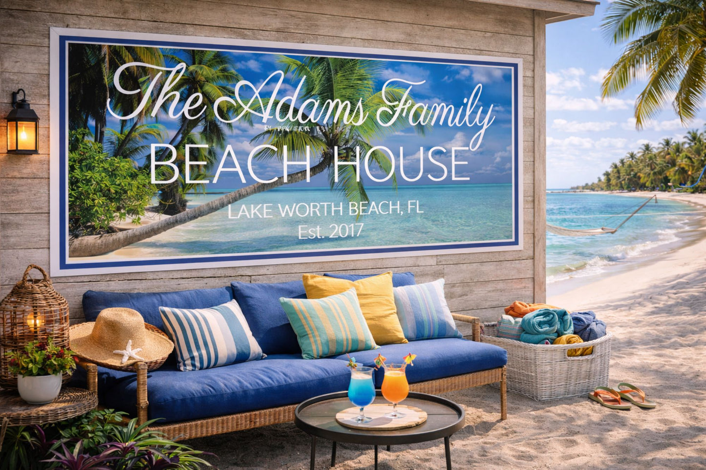 Custom beach house sign displayed on an outdoor coastal wall near patio seating