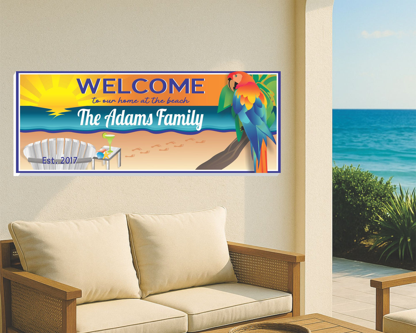 Custom beach family welcome sign mounted on a coastal living room wall with ocean view and wicker furniture