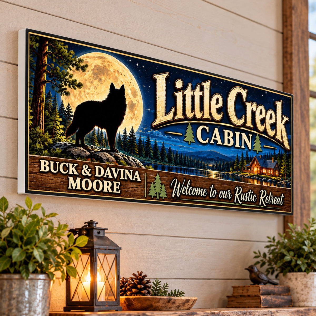 Personalized Little Creek Cabin sign mounted on a wood-paneled wall above a rustic console with lantern and greenery.