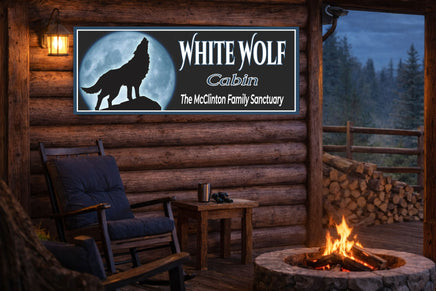 personalized cabin sign displayed on a rustic outdoor porch wall above seating area