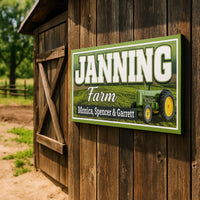 Personalized farm name sign mounted on rustic barn exterior wall