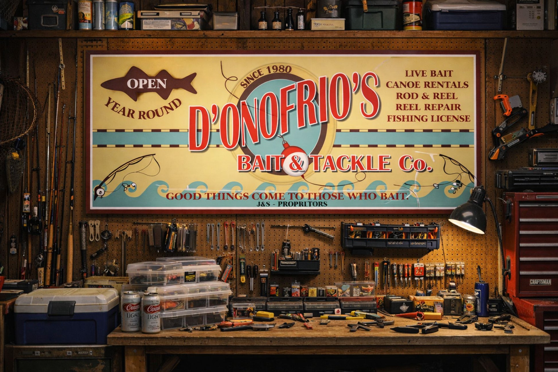 Custom bait and tackle sign displayed inside a fishing cabin or workshop