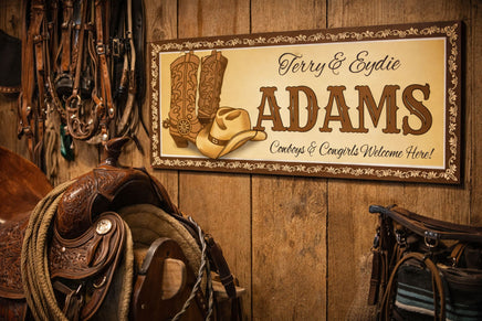 Western welcome sign mounted on a rustic barn or ranch wall with leather tack and country décor