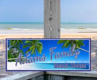 Image of a Custom Beach House Sign featuring a Blue Ocean, Sandy Beach, and Green Palm Trees