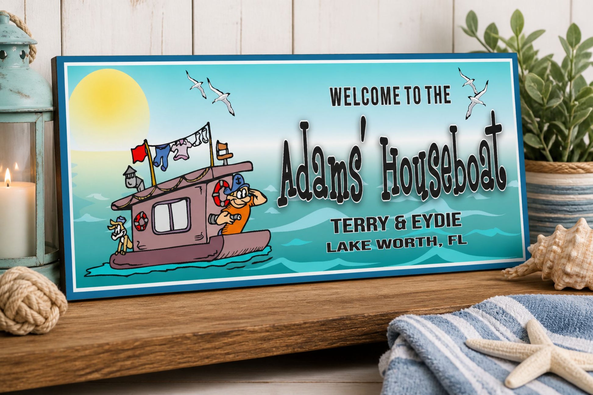 Personalized lake house sign displayed on shelf with coastal decor