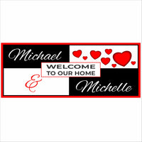 Personalized Welcome to Our Home sign with heart design, custom couple names, and bold black red and white color scheme on white background