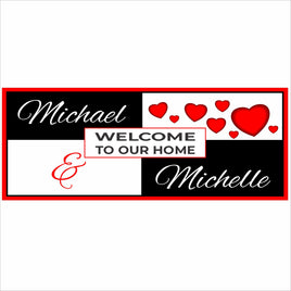 Personalized Welcome to Our Home sign with heart design, custom couple names, and bold black red and white color scheme on white background