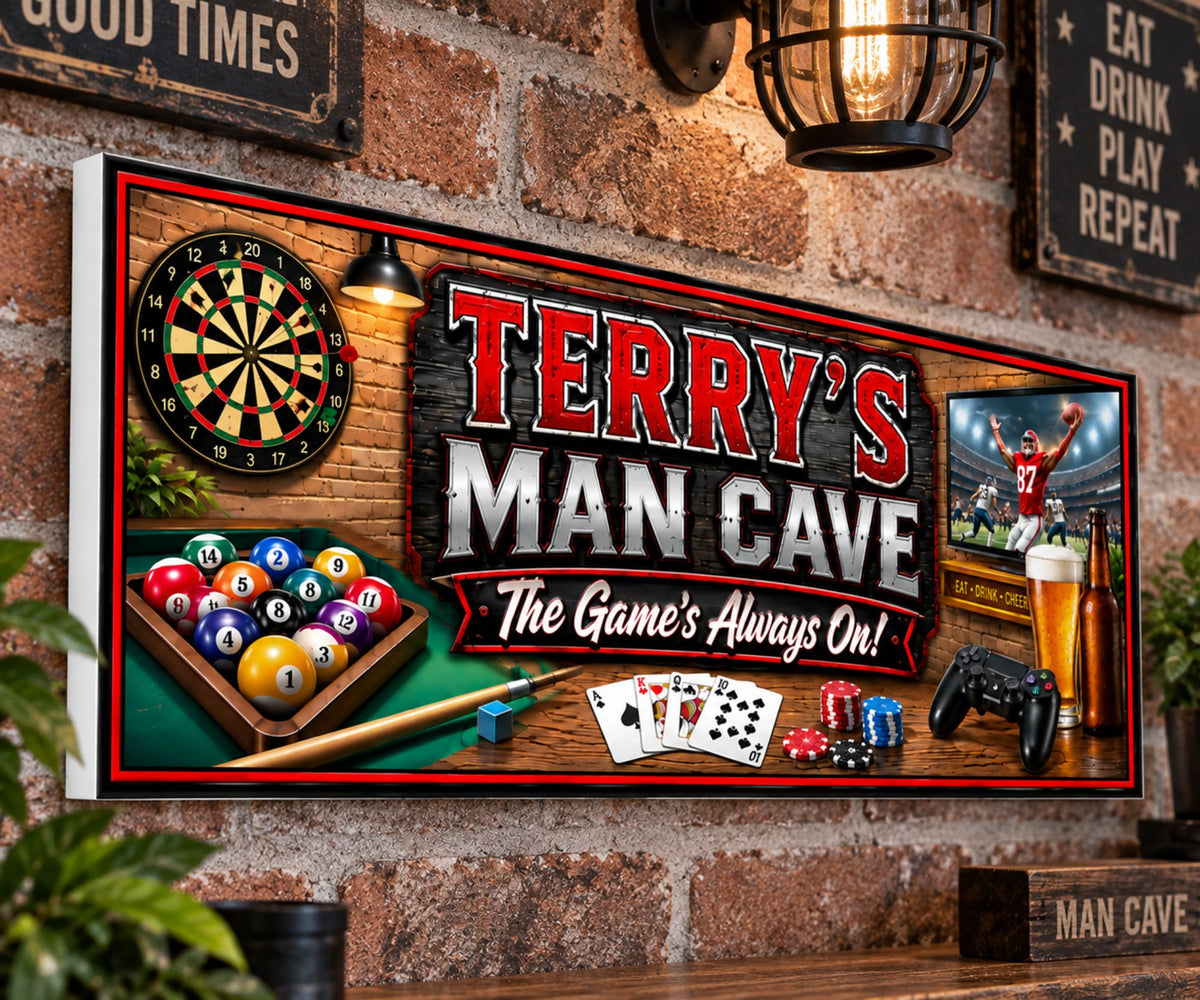 Custom game room sign displayed on brick wall above home bar shelf.