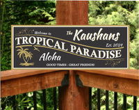 Personalized Welcome Sign with 'Aloha Tropical Paradise' Theme, Featuring Black and Gold Palm Tree and Sea Bird Silhouettes with White Text
