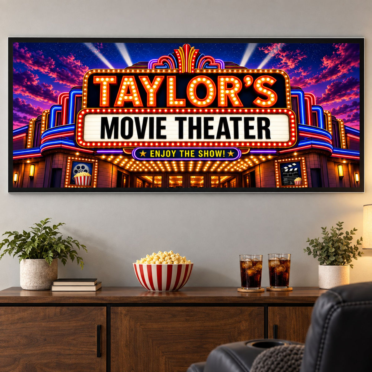 Personalized movie theater sign mounted above a home theater snack console with popcorn and drinks.