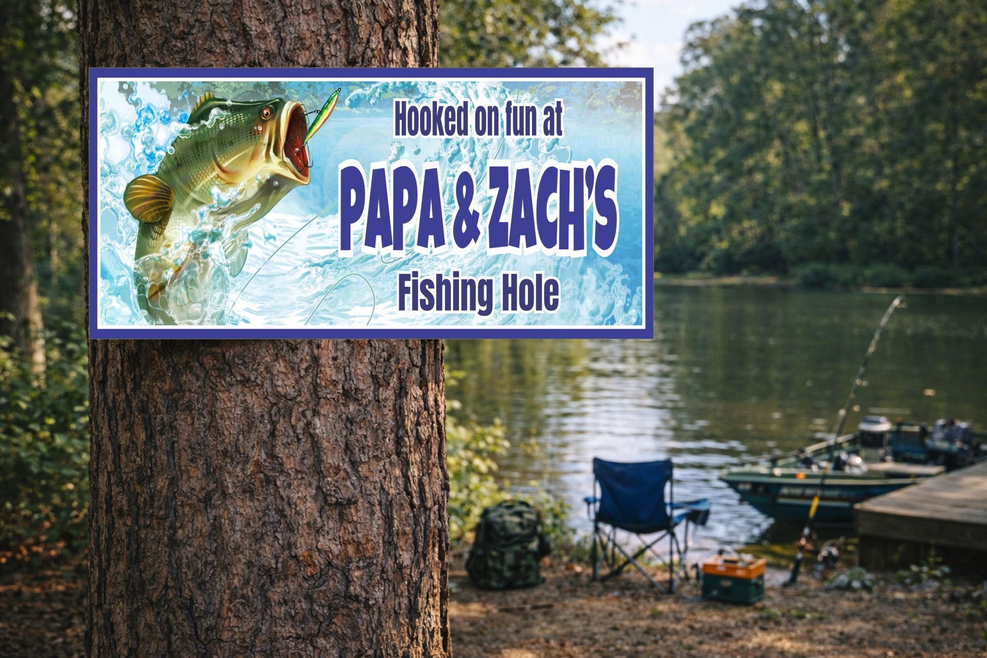 Personalized fishing hole sign displayed outdoors near a lake with fishing gear and trees