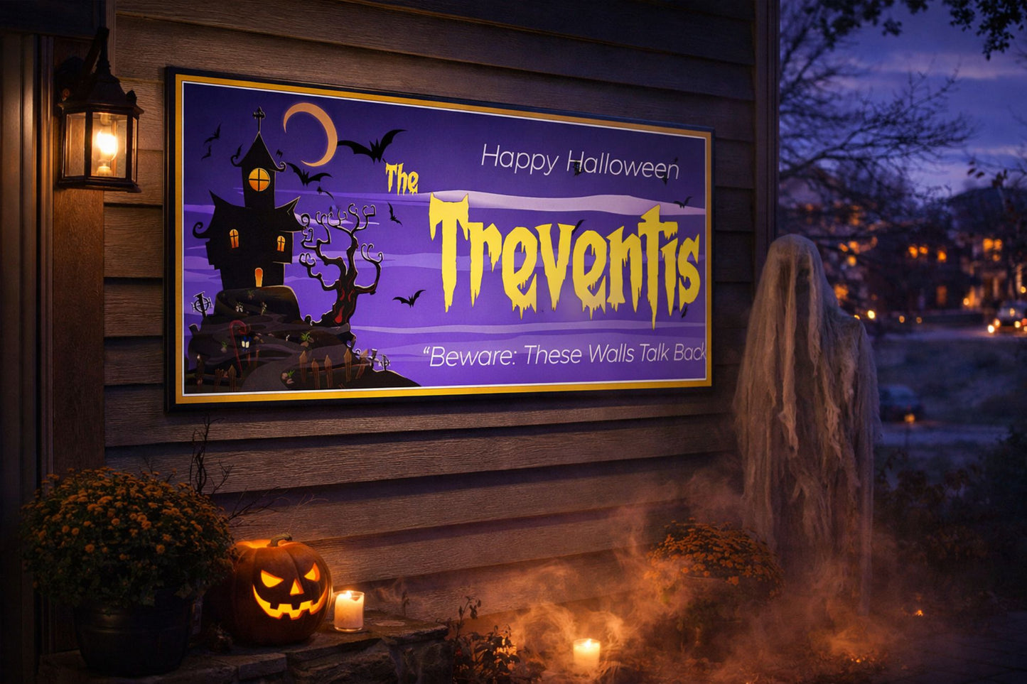 Personalized Halloween sign mounted on an exterior wall with glowing pumpkins and lanterns
