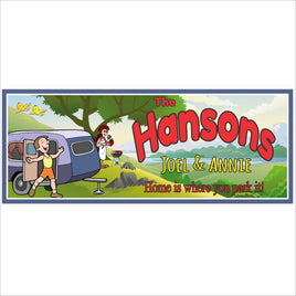 Personalized RV campsite sign with cartoon couple, camper trailer, and custom family name