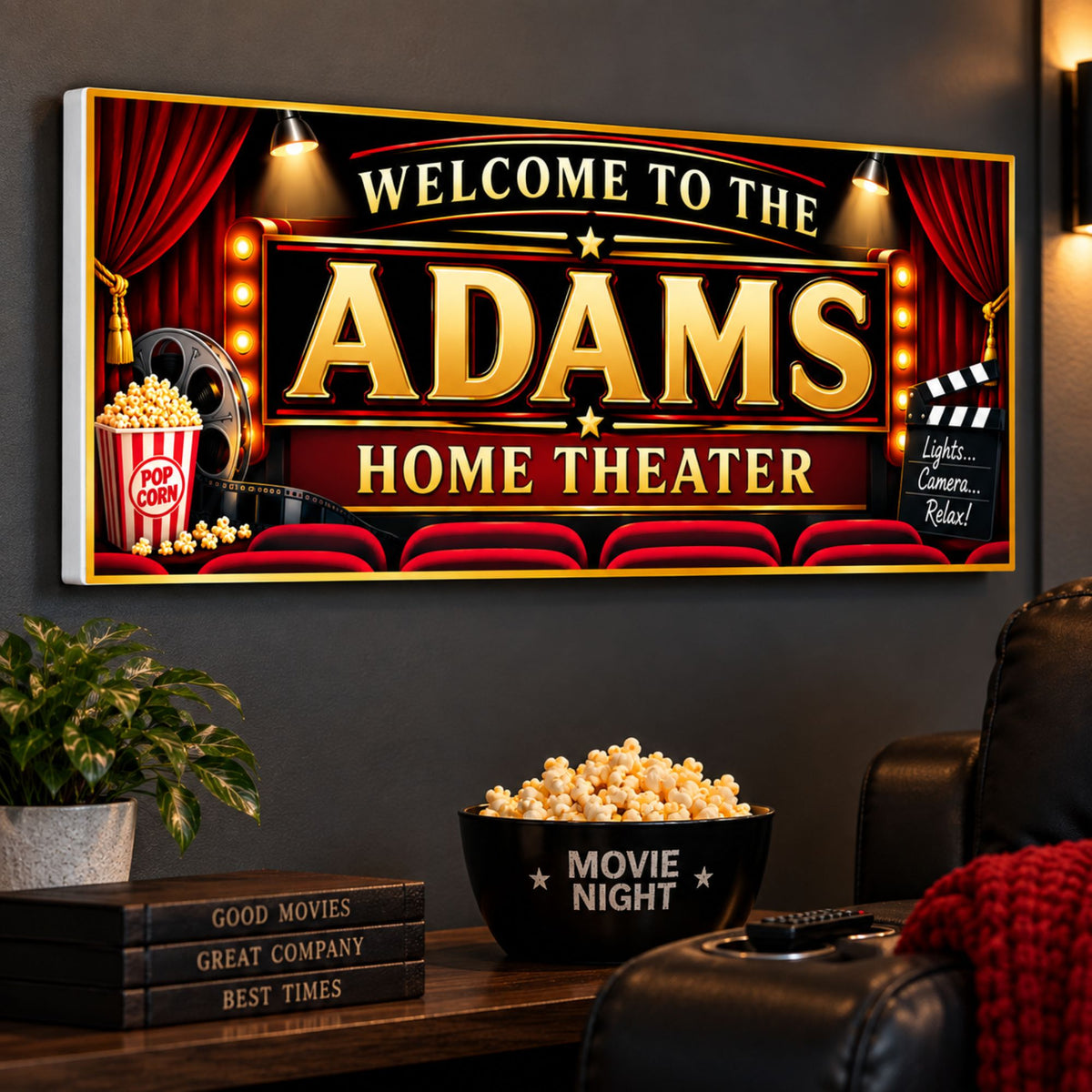 Custom red and gold home theater sign mounted on a dark wall above a movie room snack table beside a recliner.