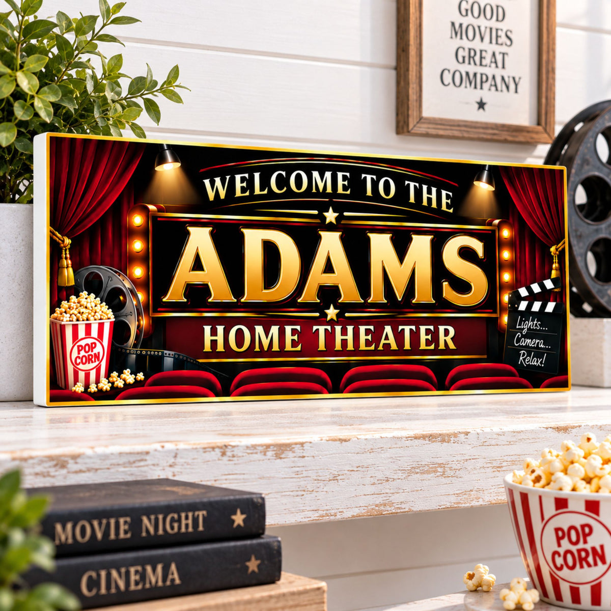 Personalized home theater sign on a white wooden shelf with a visible white PVC edge, movie books, and popcorn.