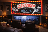 Custom home theater wall sign displayed above seating in a private movie room