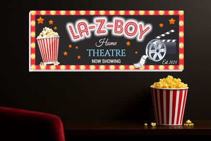 Custom movie room sign displayed in a home theatre setting with popcorn and film reel accents