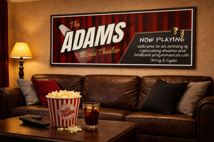 Movie theater wall sign displayed above a leather couch with popcorn and drinks in a home cinema room