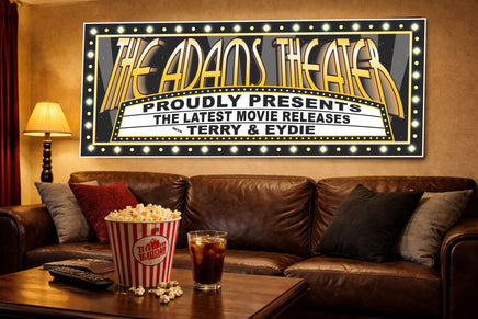 Home theater room with leather couch, popcorn, and a marquee-style movie sign mounted on the wall