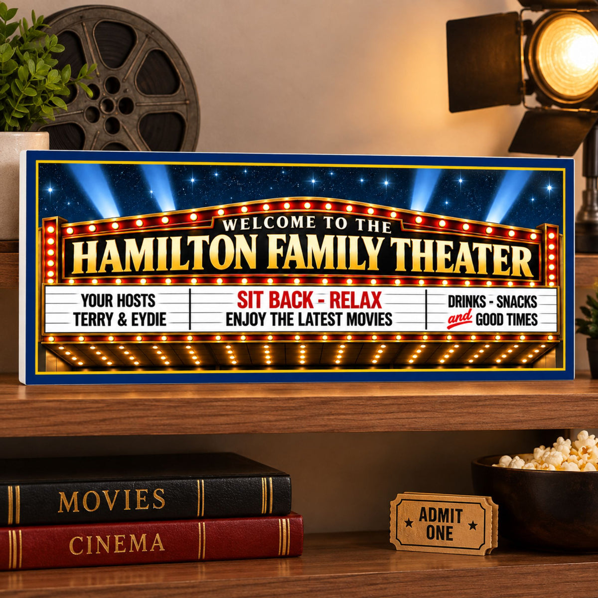 Personalized family theater marquee sign displayed on a shelf with movie-themed decor and classic cinema styling.
