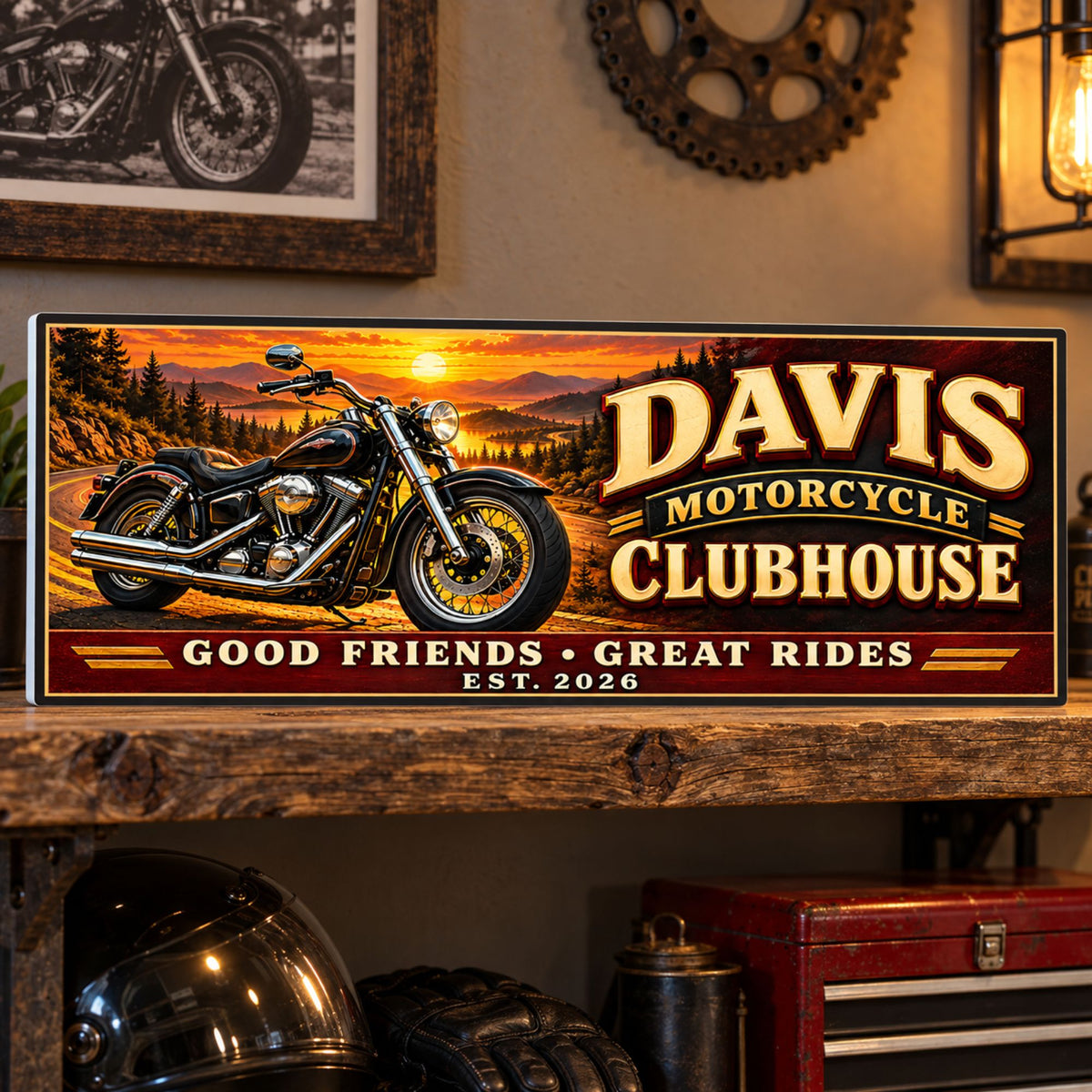 Custom motorcycle sign displayed on a rustic wooden shelf with motorcycle artwork and riding accessories.