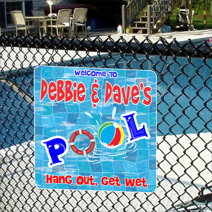 "Personalized Swimming Pool Sign with wavy blue mosaic background, beach ball, and life preserver.