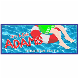 Personalized pool sign with floating swimmer graphic, blue water background, and custom family name