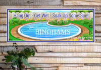 Custom swimming pool sign featuring a round pool design surrounded by flowers and a wooden fence, ideal for poolside decoration.