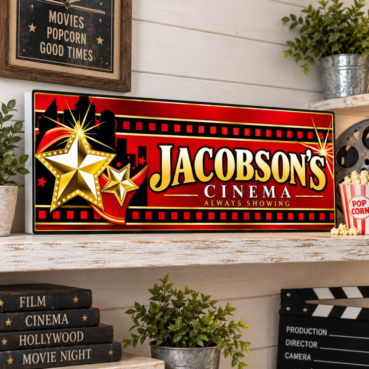 Custom cinema sign displayed in a home movie room with Hollywood and theater-inspired décor.