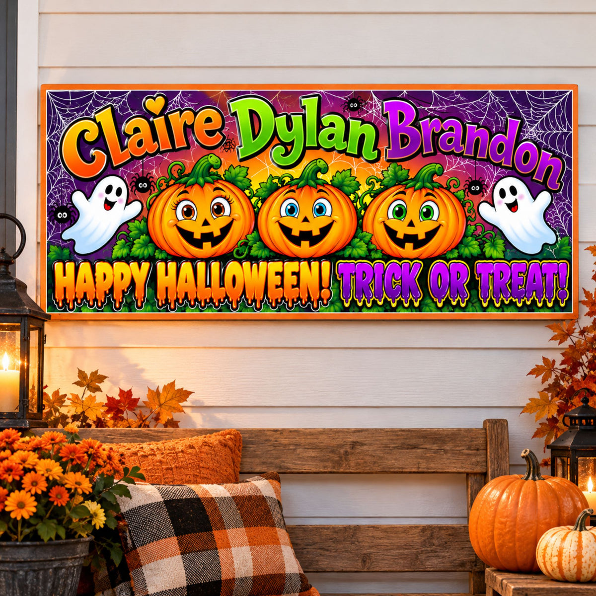 Custom Halloween wall sign displayed above a rustic porch bench with autumn flowers, pumpkins and seasonal decorations.
