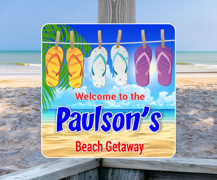 Personalized welcome beach sign displaying flip flops on a clothesline against an ocean background, with editable text options.