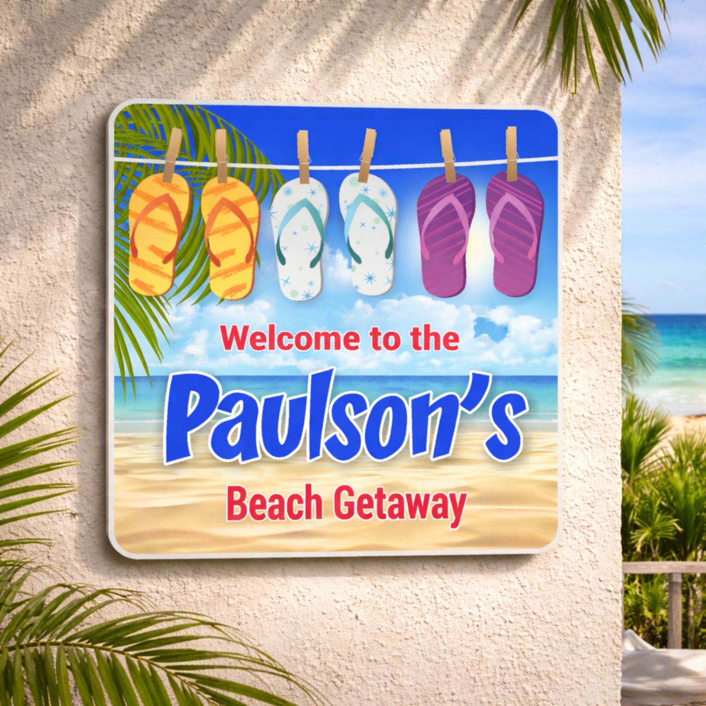 Personalized beach sign mounted on an exterior wall in a coastal outdoor setting