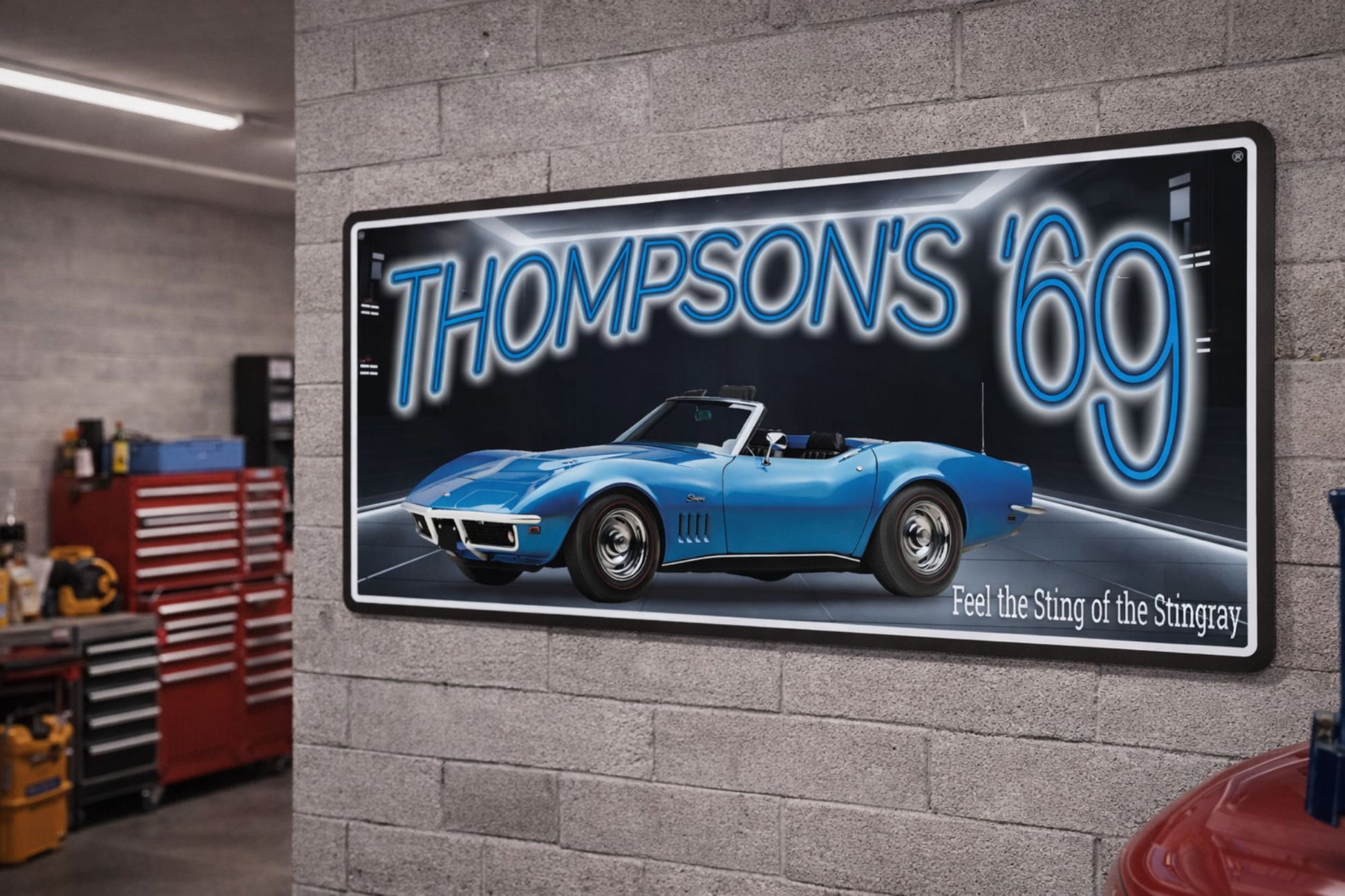 vintage style 1969 classic car sign mounted on a garage wall 