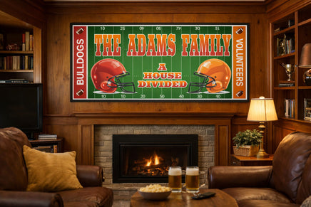 Personalized football-themed house divided sign mounted above a stone fireplace in a cozy wood-paneled den with leather chairs, warm lighting, and sports décor