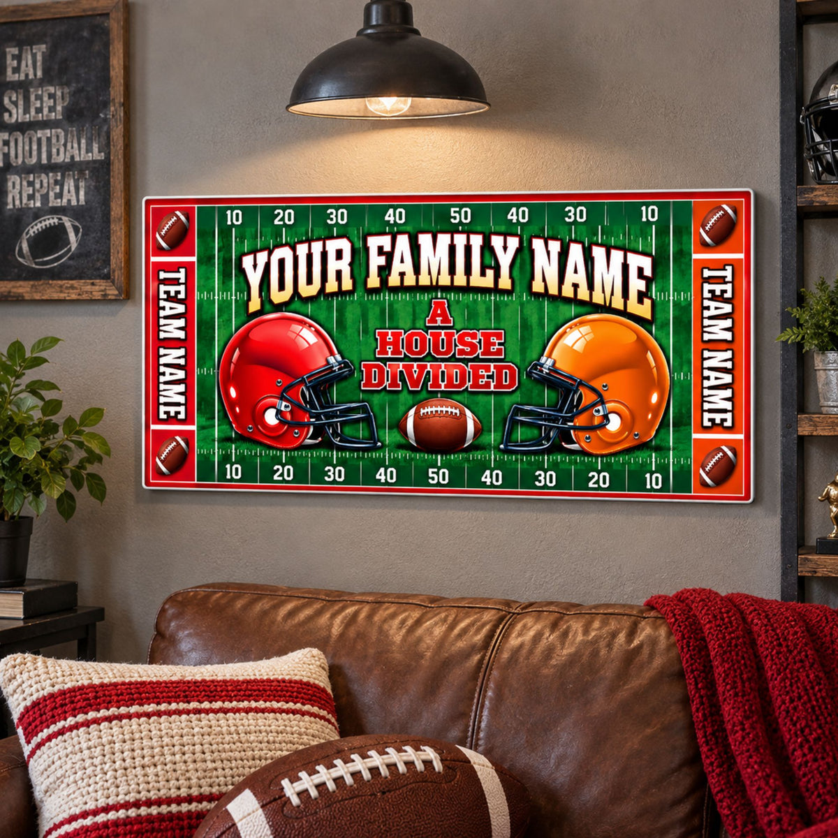 Custom House Divided football sign mounted above a leather sofa in a game room, featuring family name, two teams and coordinated colors.