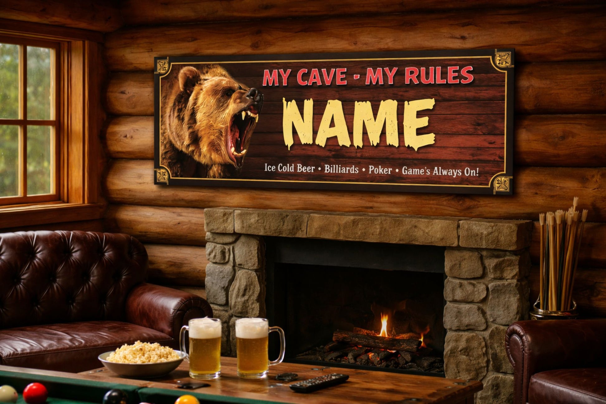Personalized bear-themed man cave sign mounted above a stone fireplace in a rustic log cabin room with leather seating, pool table, beer mugs, and warm ambient lighting