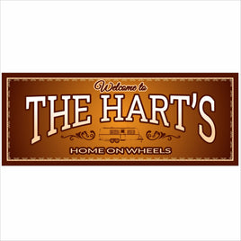 Personalized RV welcome sign with “The Hart’s Home on Wheels” text and vintage motorhome design