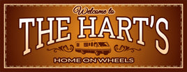 Customizable RV welcome sign with elegant gold flourishes and editable text fields, set against a choice of RV styles.