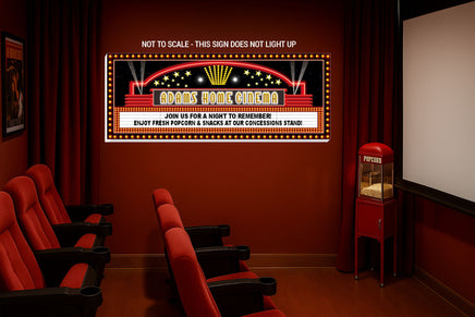 Custom home theater sign displayed inside a movie room with red theater seats