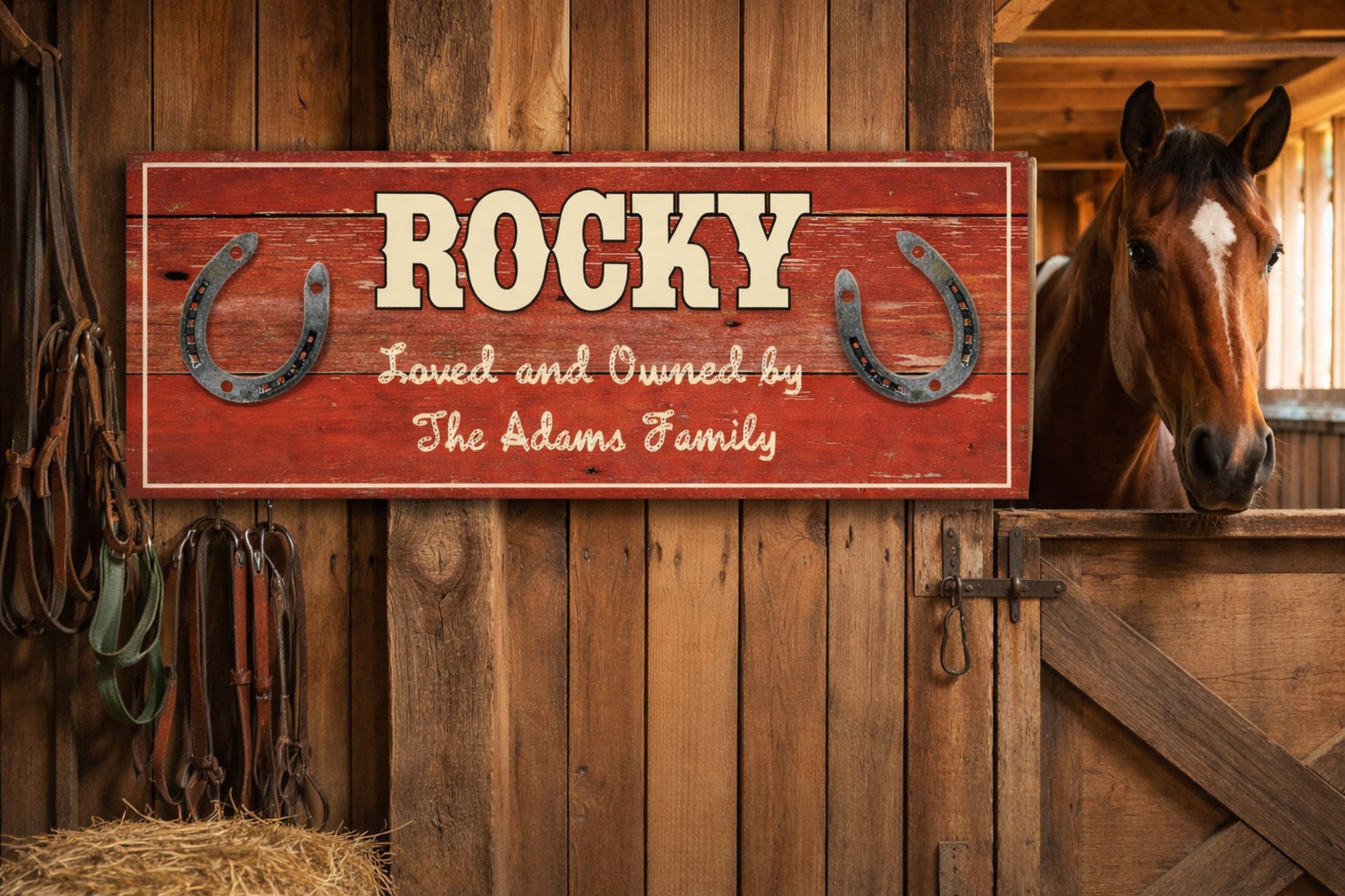 Personalized horse stall sign mounted inside a barn with horse and tack equipment