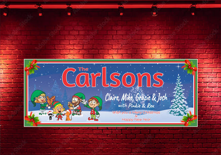 Personalized Christmas sign featuring Santa's elves family with a dog and cat, wishing everyone a Merry Christmas, framed by a holly berry border.